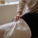 Close-up of a massage therapist performing a relaxing treatment on a client in a spa.
