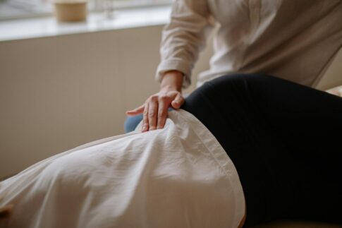 Close-up of a massage therapist performing a relaxing treatment on a client in a spa.