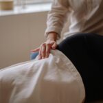 Close-up of a massage therapist performing a relaxing treatment on a client in a spa.