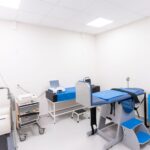 A clean and equipped medical examination room with diverse healthcare tools.