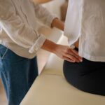 Close-up of a therapist providing a relaxing back massage to a client in a wellness setting.